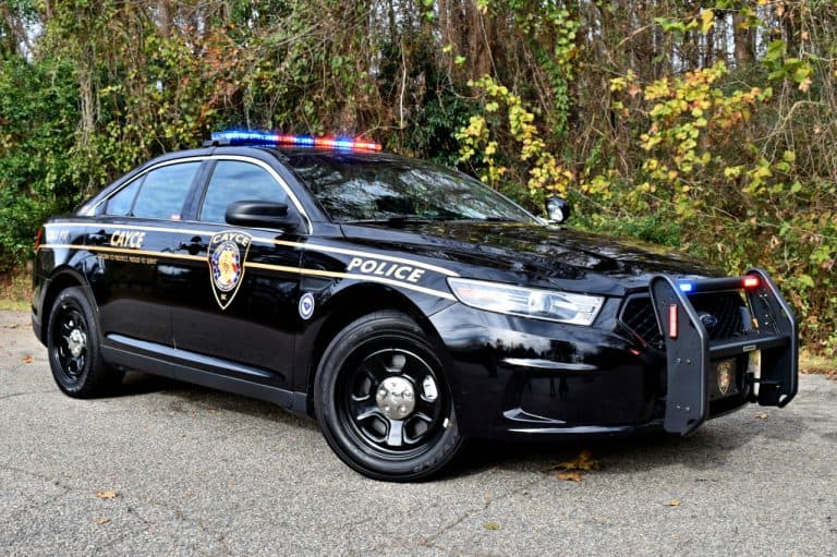 Cayce patrol sedan with red and blue lights activated