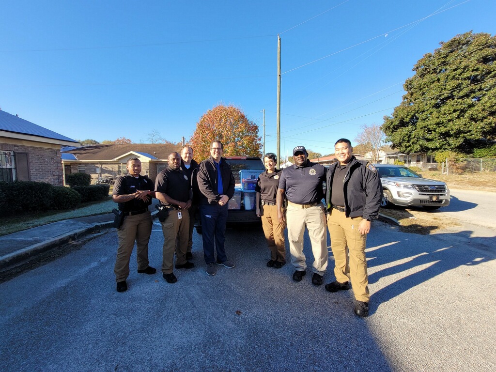 Community Service Officers preparing to deliver thanksgiving food baskets