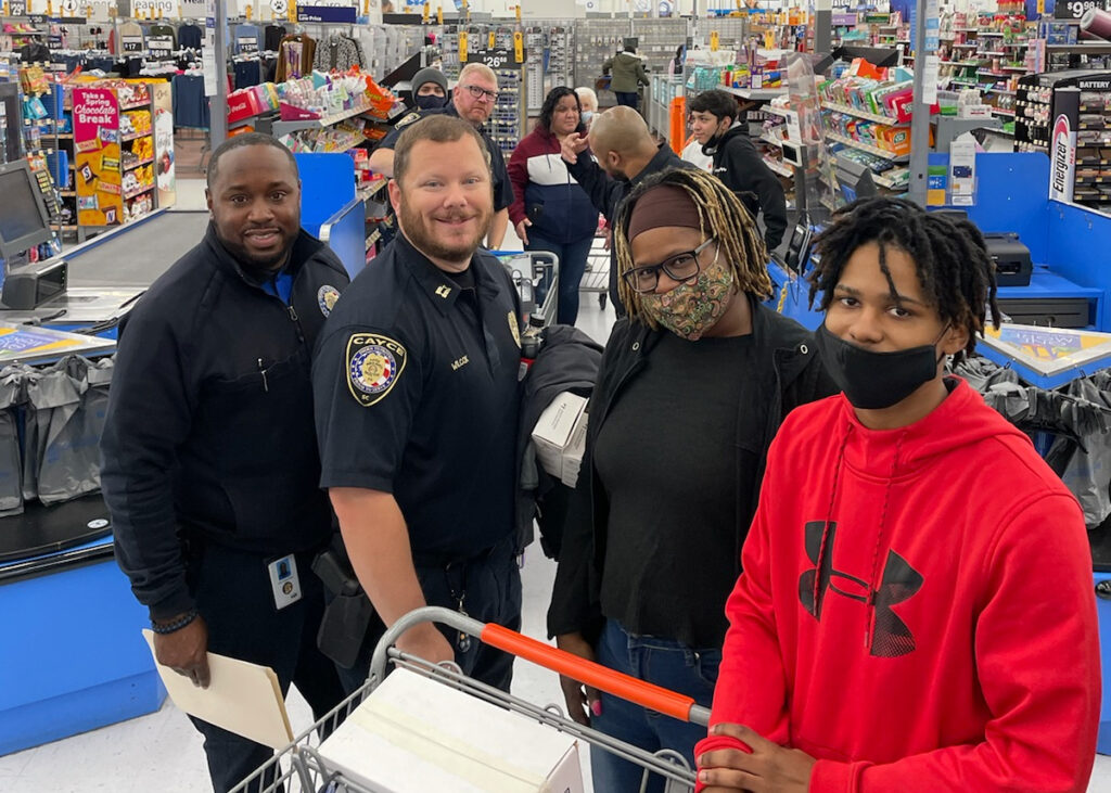 Cayce officers, West and Wilcox with participants of shop with a cop 2021