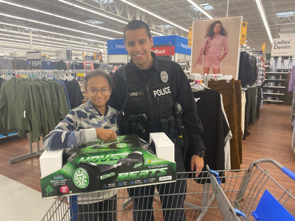 School Resource Officer Lopez with JV participant of shop with a cop 2021