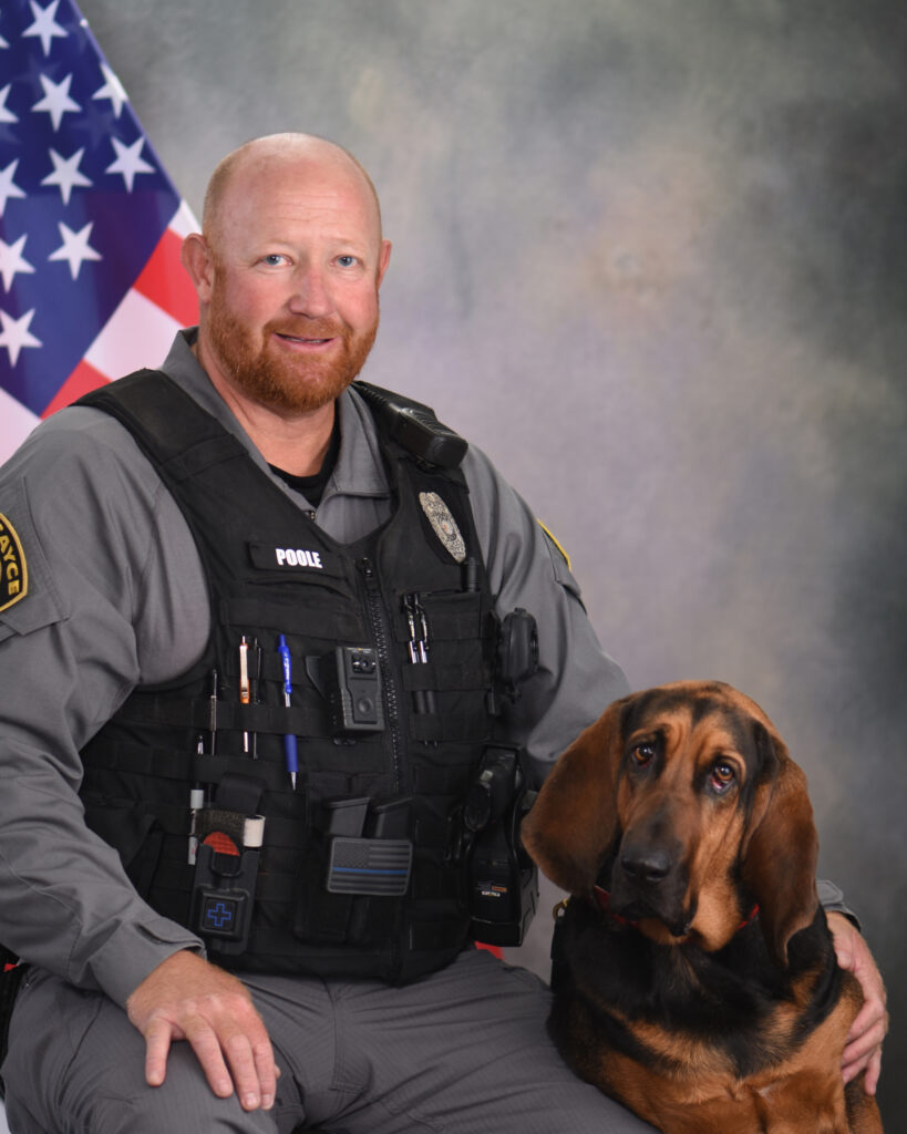headshot of K9 officer Poole and K9 Bella